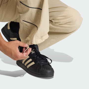 Wide Leg Pantalon 'Cutline' ADIDAS ORIGINALS en vert