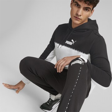 PUMA - Tapered Pantalón deportivo en negro