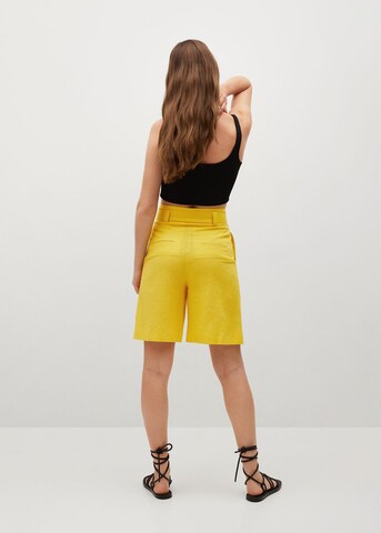 MANGO Szeroka nogawka Spodnie 'Laci' w kolorze żółty