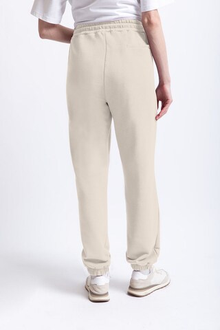 UNIQVIBE Tapered Pants in Beige