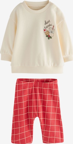 Next Juoksupuku värissä punainen: etupuoli