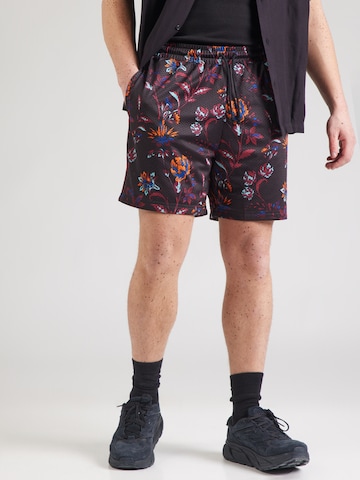 PUMA Regular Trousers 'FLORAL SPORT' in Black: front
