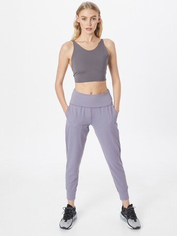 UNDER ARMOUR - Tapered Calças de desporto 'Meridian' em roxo