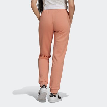 ADIDAS ORIGINALS Tapered Trousers in Orange