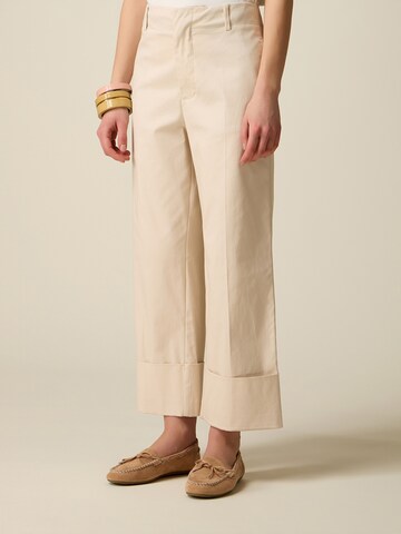 oltre Baggy Pants in Beige: front