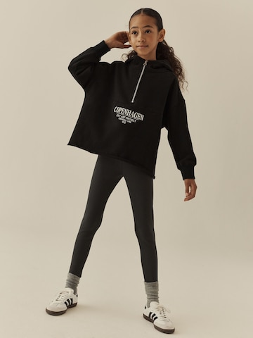 Next - Conjunto en negro: frente