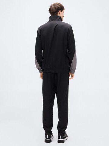 PUMA Trainingspak in Zwart