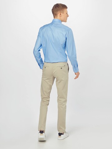 TOMMY HILFIGER - Slimfit Pantalón chino 'DENTON TH FLEX SATIN CHINO GMD' en beige