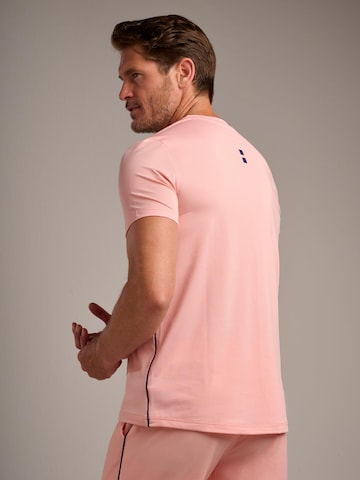 nordicdots - Camiseta funcional 'Performance V-Tee' en naranja