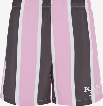 Karl Kani Board Shorts in Pink: front