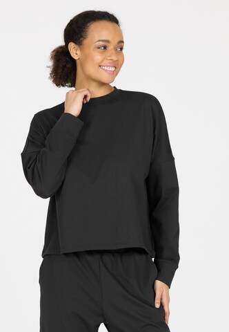 Athlecia Sports sweatshirt in Black: front
