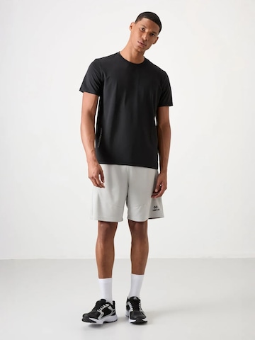 T-Shirt fonctionnel Tommy Life en noir