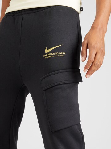 Effilé Pantalon cargo Nike Sportswear en noir