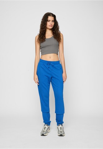 Tapered Pantaloni di Urban Classics in blu