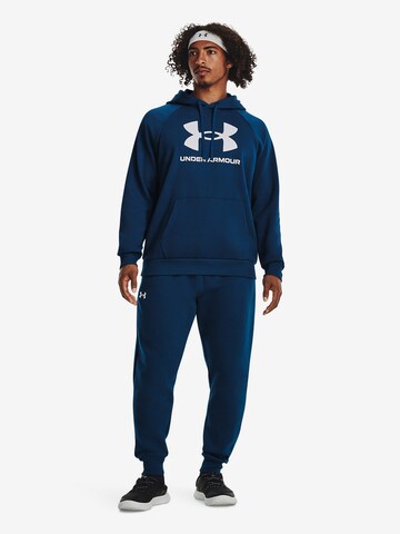 UNDER ARMOUR Tapered Sportbroek in Blauw