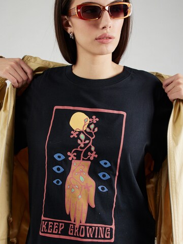 Maglietta 'KEEP GROWING' di RVCA in nero