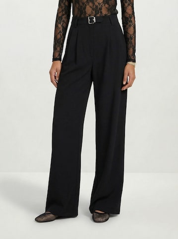 Hoermanseder Regular Pleat-front trousers in Black: front