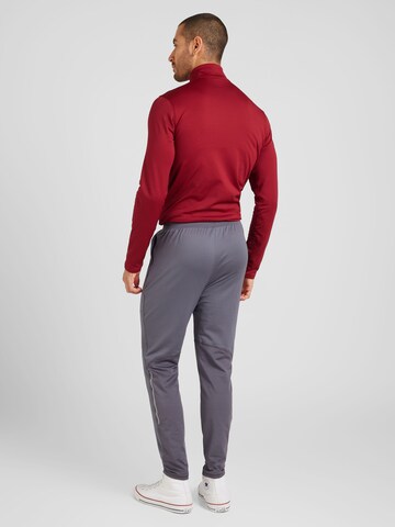 UNDER ARMOUR - Tapered Calças de desporto 'Vanish CW' em cinzento