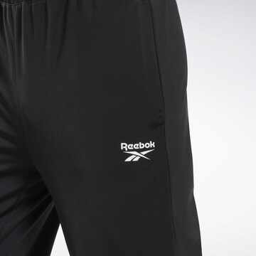 Effilé Pantalon de sport Reebok en noir