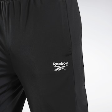 Tapered Pantaloni sportivi di Reebok in nero