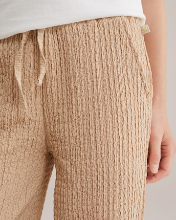 WE Fashion Loose fit Trousers in Beige
