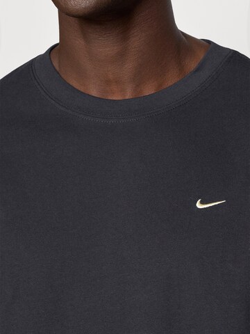 T-Shirt fonctionnel NIKE en noir