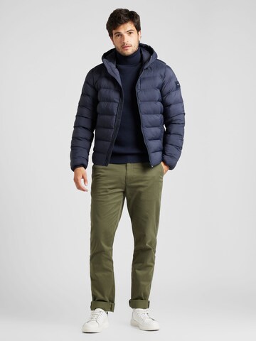 TOMMY HILFIGER Tussenjas in Blauw