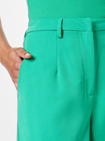 Wide leg Pantaloni con pieghe di minimum in verde