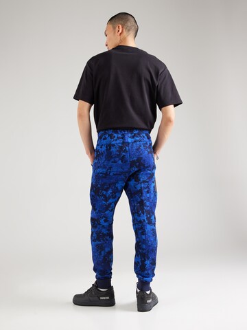 mėlyna Nike Sportswear Siaurėjantis Kelnės 'TCH FLC'