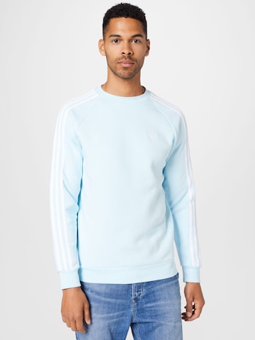 ADIDAS ORIGINALSRegular Fit Sweater majica 'Adicolor Classics 3-Stripes' - plava boja: prednji dio