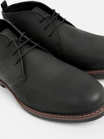 Next Chukka Boots in Schwarz