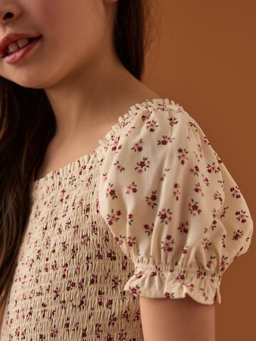Tuta di Next in beige