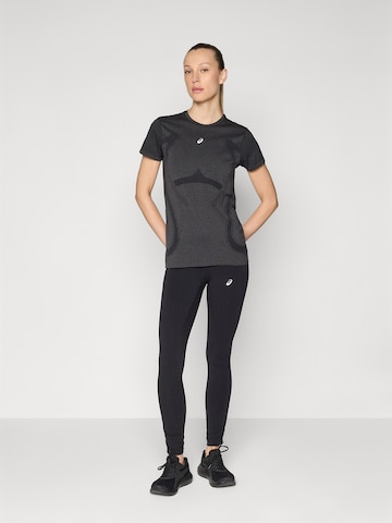 ASICSSkinny Sportske hlače 'NAGINO' - crna boja