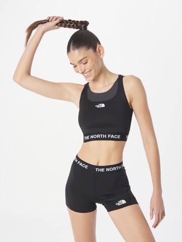 THE NORTH FACE - Soutien Bustier Soutien de desporto em preto: frente