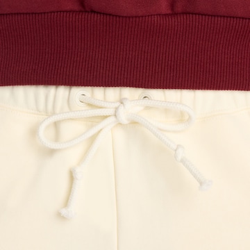 new balance - Regular Calças 'LNY Knit Pant' em bege