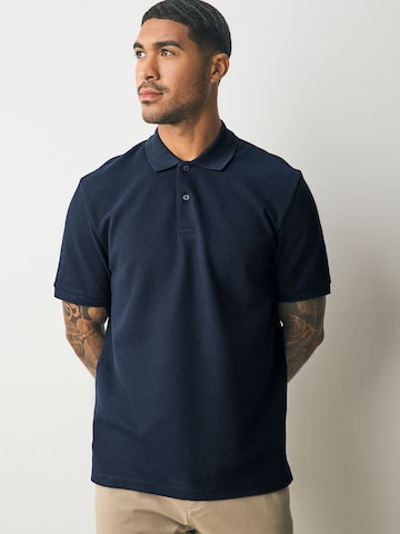Tricou de la Next pe albastru: față