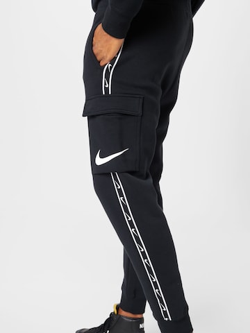 Effilé Pantalon cargo Nike Sportswear en noir