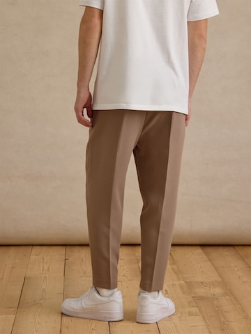 DAN FOX APPAREL Tapered Trousers with creases 'Toni' in Beige