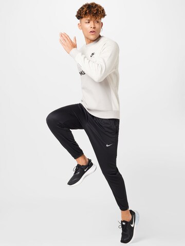 NIKE Slimfit Sporthose 'Challenger' in Schwarz