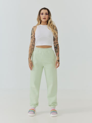 ABOUT YOU x Sharlota Tapered Pants 'Nala' in Green