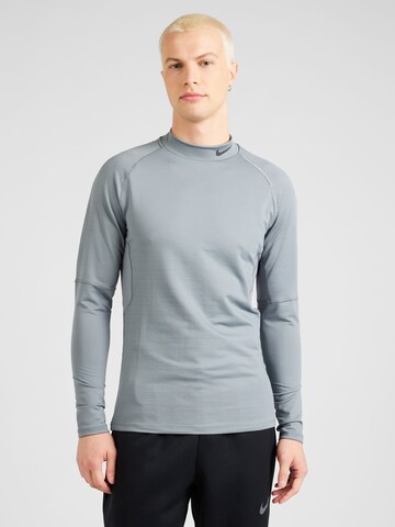 T-Shirt fonctionnel NIKE en gris : devant