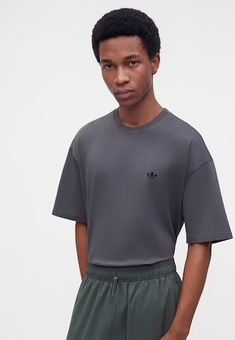 ADIDAS ORIGINALSLoosefit Hlače 'TEAMGEIST' - siva boja