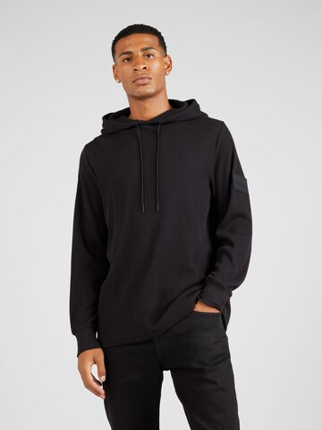 Sweat-shirt Calvin Klein Jeans en noir : devant