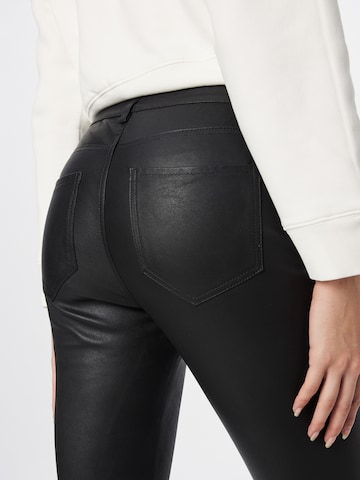 Skinny Pantaloni 'INA' de la AllSaints pe negru