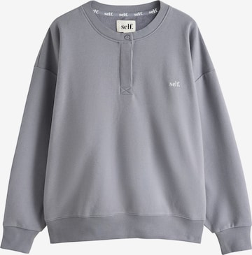 self. Sweatshirt i grå: forside