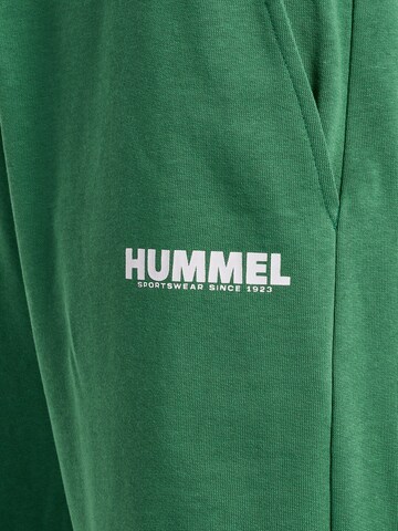 Tapered Pantaloni sportivi di Hummel in verde