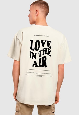 Merchcode T-Shirt 'Love In The Air' in Beige: predná strana