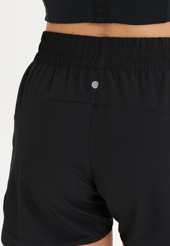 Athlecia Regular Workout Pants 'Creme' in Black