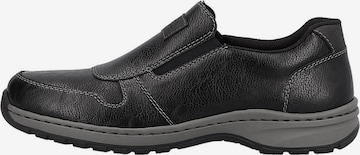 Rieker Slipper in Schwarz