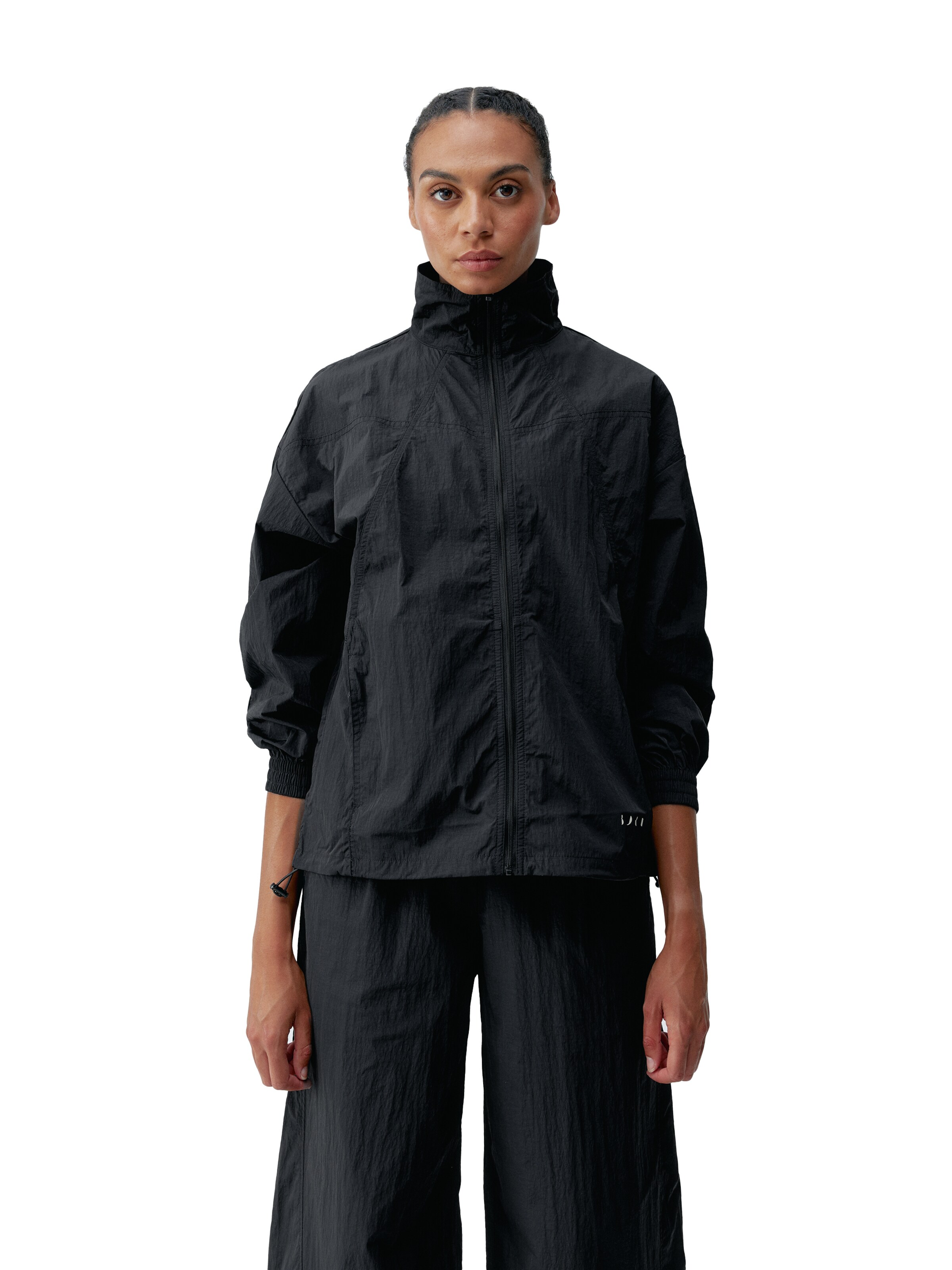 Born Living Yoga Tussenjas 'Amara' in Zwart: voorkant